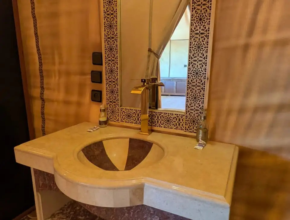 Private bathroom with carved stone sink