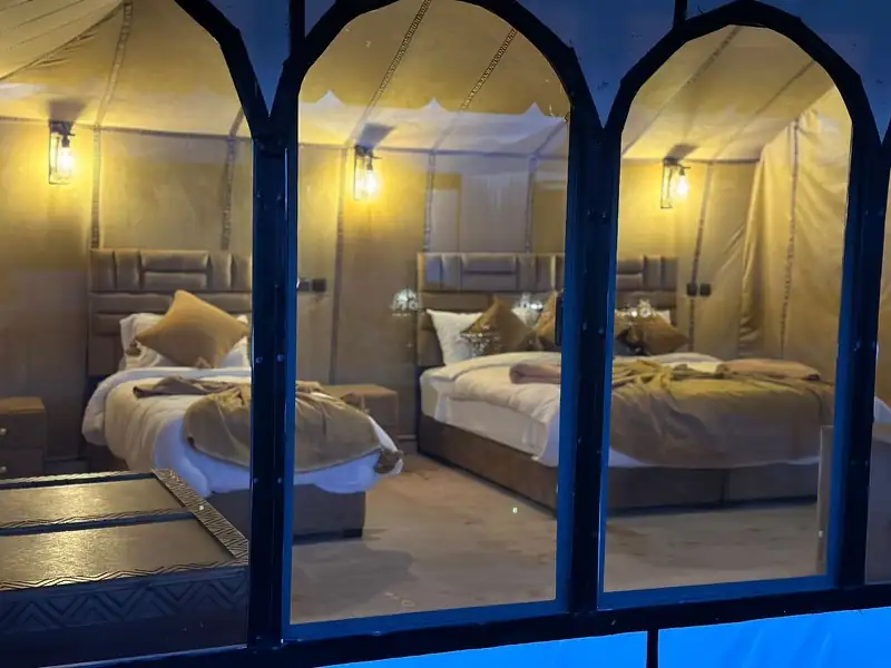 Tent seen through a Moroccan arched window