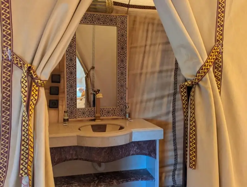 Bathroom with carved stone sink